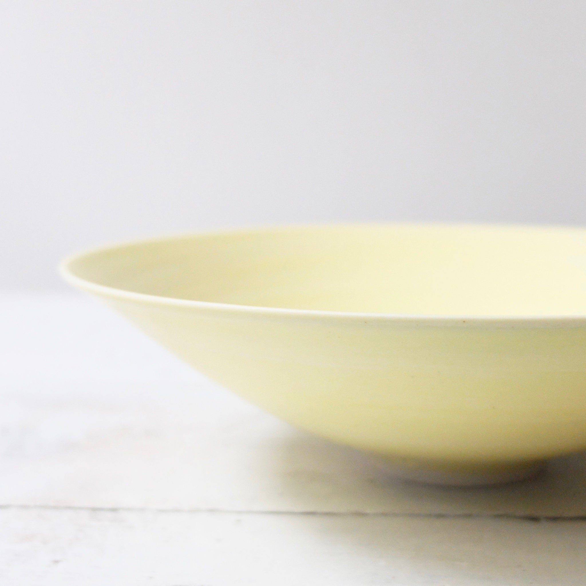 Peter Wills Shallow Yellow Porcelain Bowl with Bronze Band